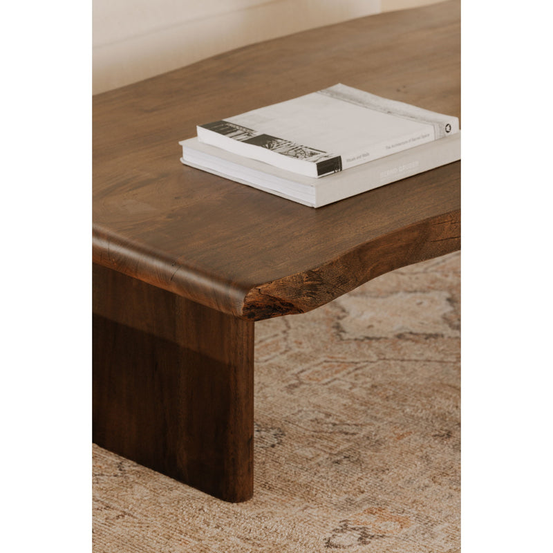 Brown wooden coffee table corner with visible grain and square leg