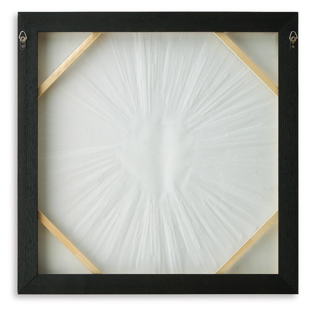 Black framed wall art with octagonal gold accents and white sunburst center