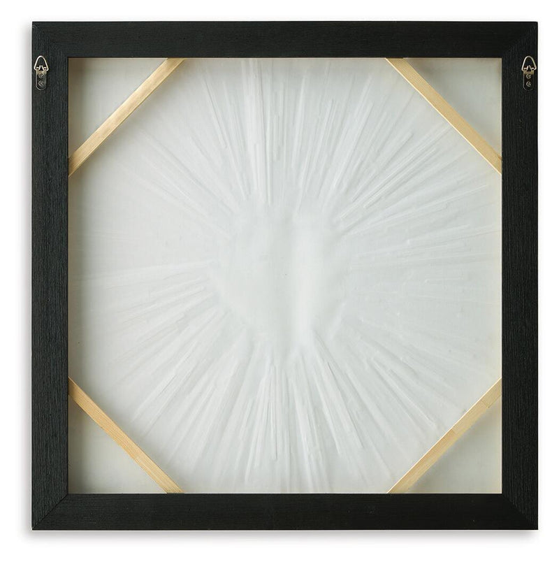 Black framed wall art with octagonal gold accents and white sunburst center