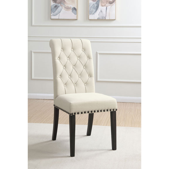 Beige tufted rolled backrest side chair with nailhead trim and dark wooden legs