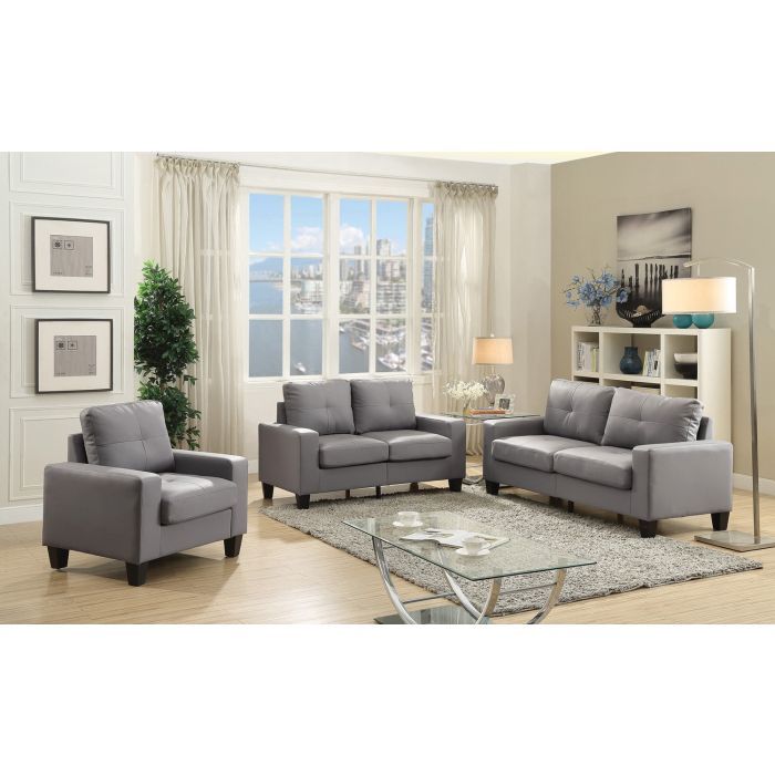 Dark gray faux leather loveseat with track arms in living room setting