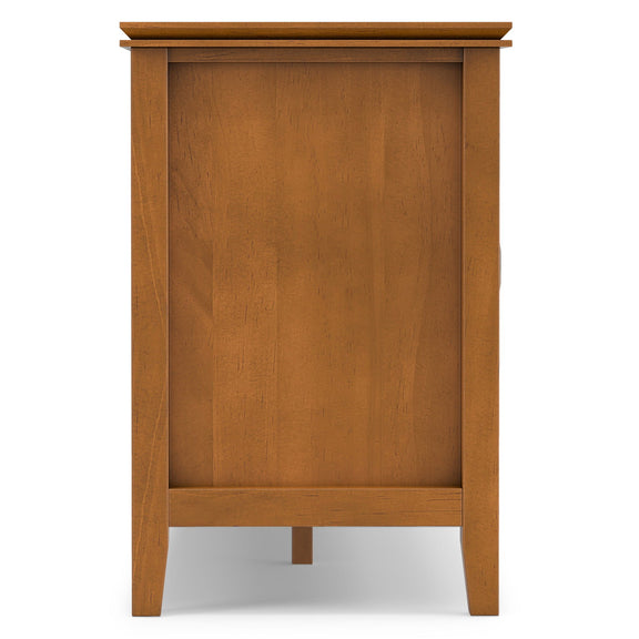 Light brown wood TV media stand with open base compartment and side panels