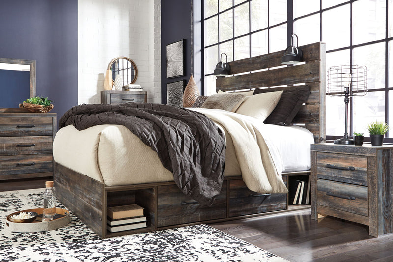 Drystan panel bed with dark wood frame, slatted headboard, and neutral throw pillows