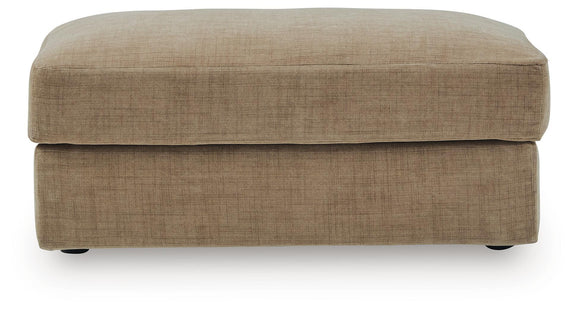 Honey beige upholstered ottoman with rounded top and storage lid