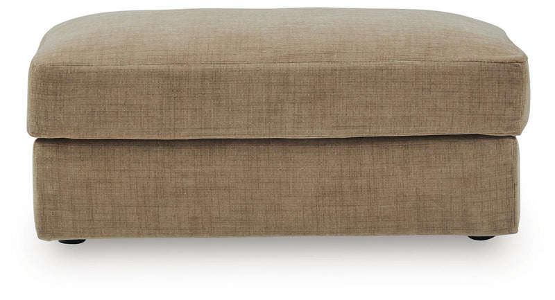 Honey beige upholstered ottoman with rounded top and storage lid