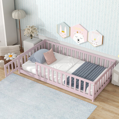 Pink twin floor bed with tall guardrails, mattress and pillows