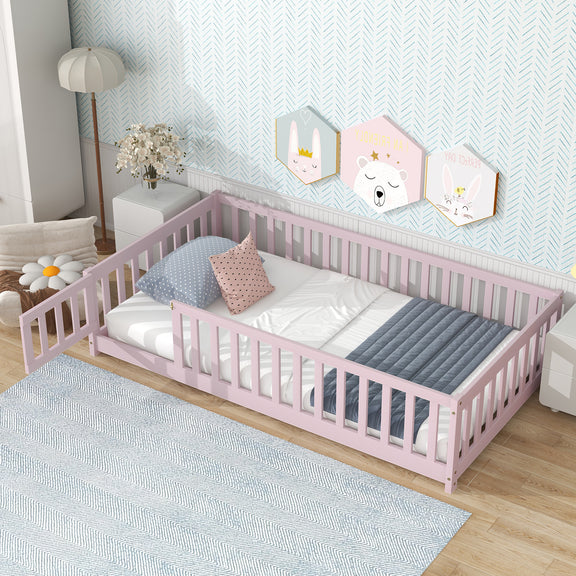 Pink twin floor bed with tall guardrails, mattress and pillows