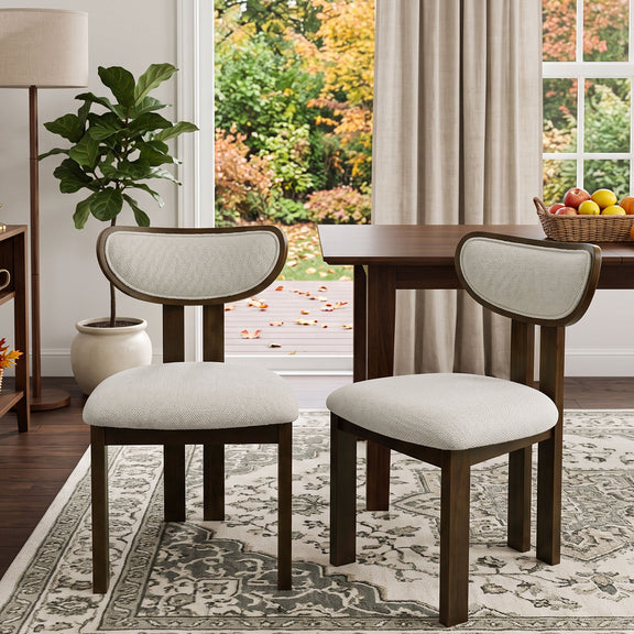 Beige upholstered dining chairs with curved backs and dark wood frames