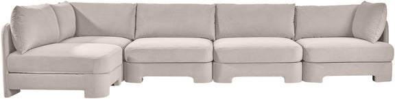 Light gray velvet sectional sofa with wide seats and multiple back cushions