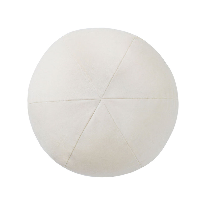 Round pillow in cream fabric with central star seam pattern.