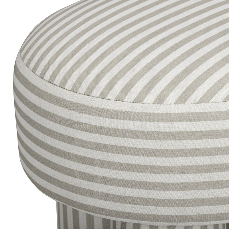 Gray and cream striped upholstered accent stool with close-up of round seat and side.