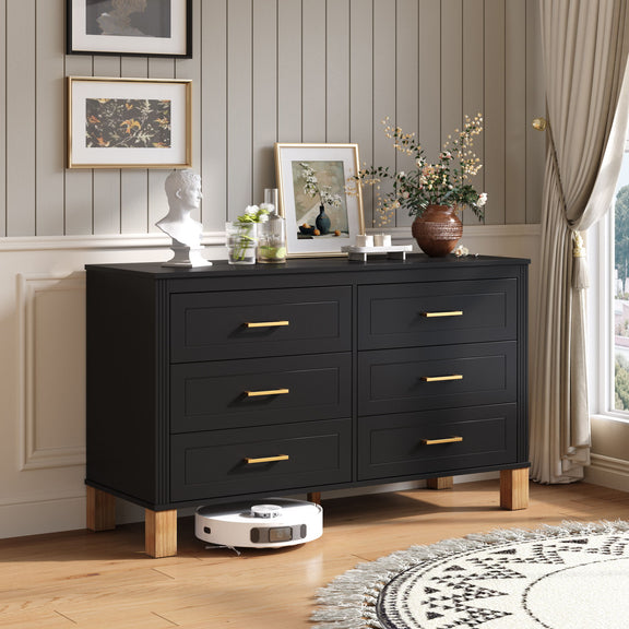 Black double dresser with six drawers, gold-tone bar pulls, and wooden feet.
