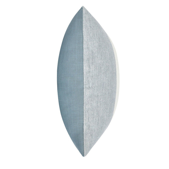 Blue textured throw pillow with stitched edge, narrow side view