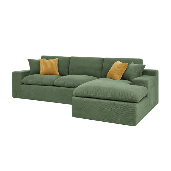 Dark green sectional sofa with chaise and two yellow accent pillows