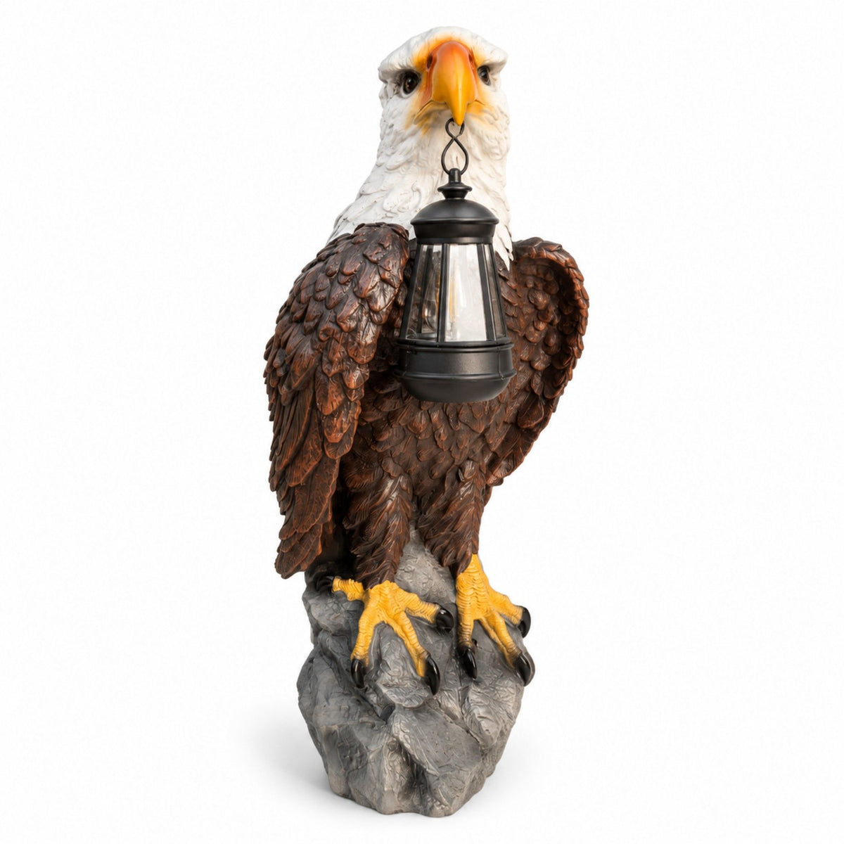 Bald eagle garden statue with a hanging black lantern, brown feathers and gray rock base