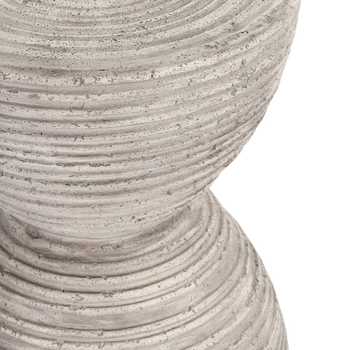 Close-up of light gray ribbed texture on hourglass outdoor accent table