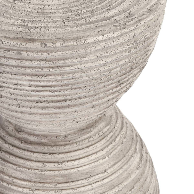 Close-up of light gray ribbed texture on hourglass outdoor accent table
