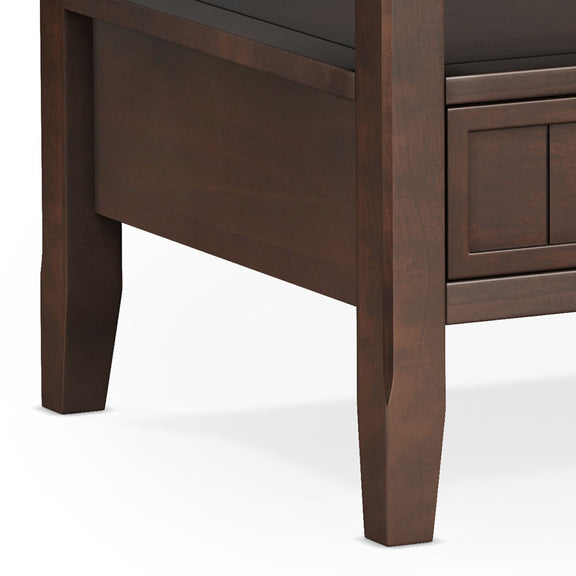 Brown coffee table with drawer front and angled leg, close-up