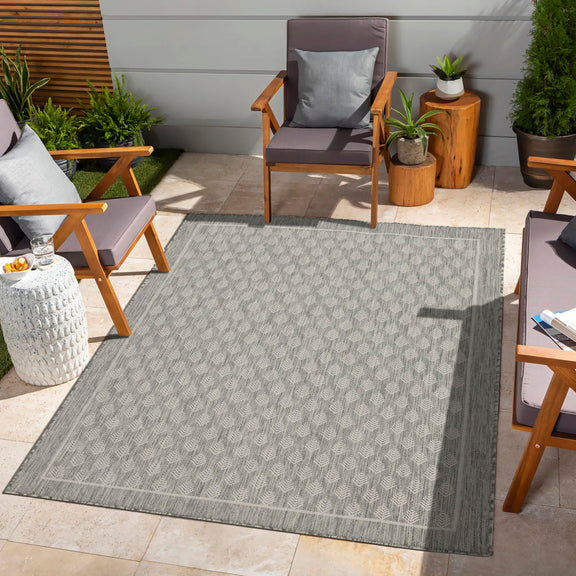 Blue indoor/outdoor area rug with repeating diamond pattern
