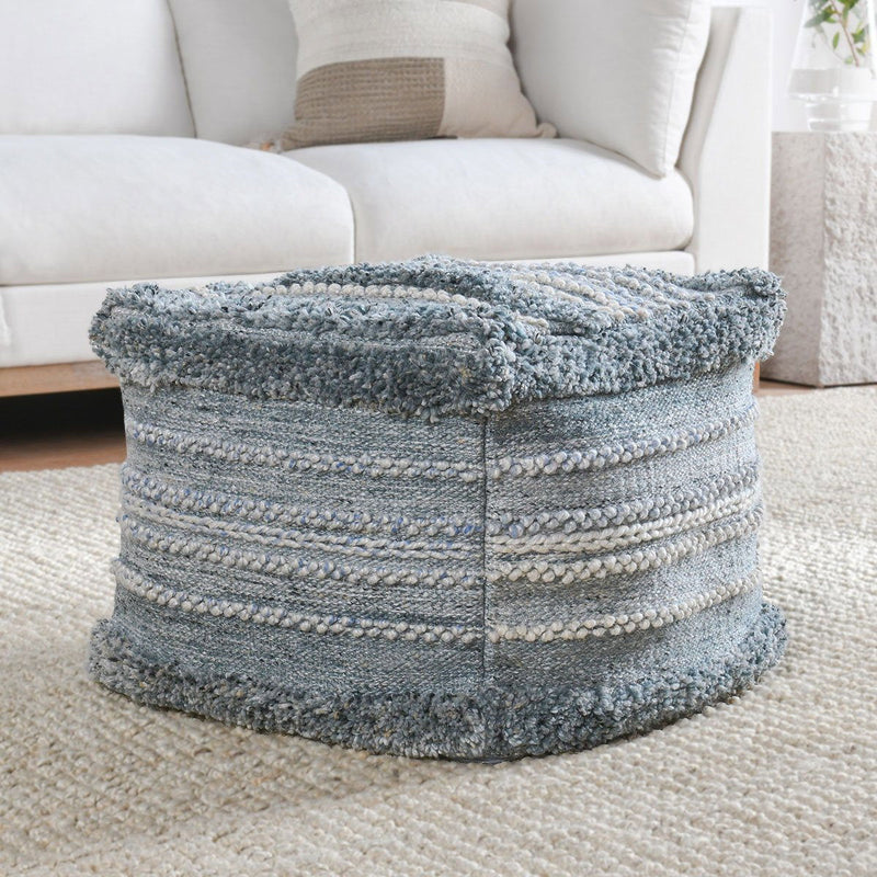 Blue woven pouf ottoman with round shape and light striped bands