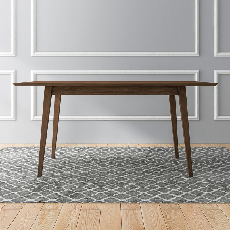 Dark brown rectangular dining table with four slim legs and flat top.