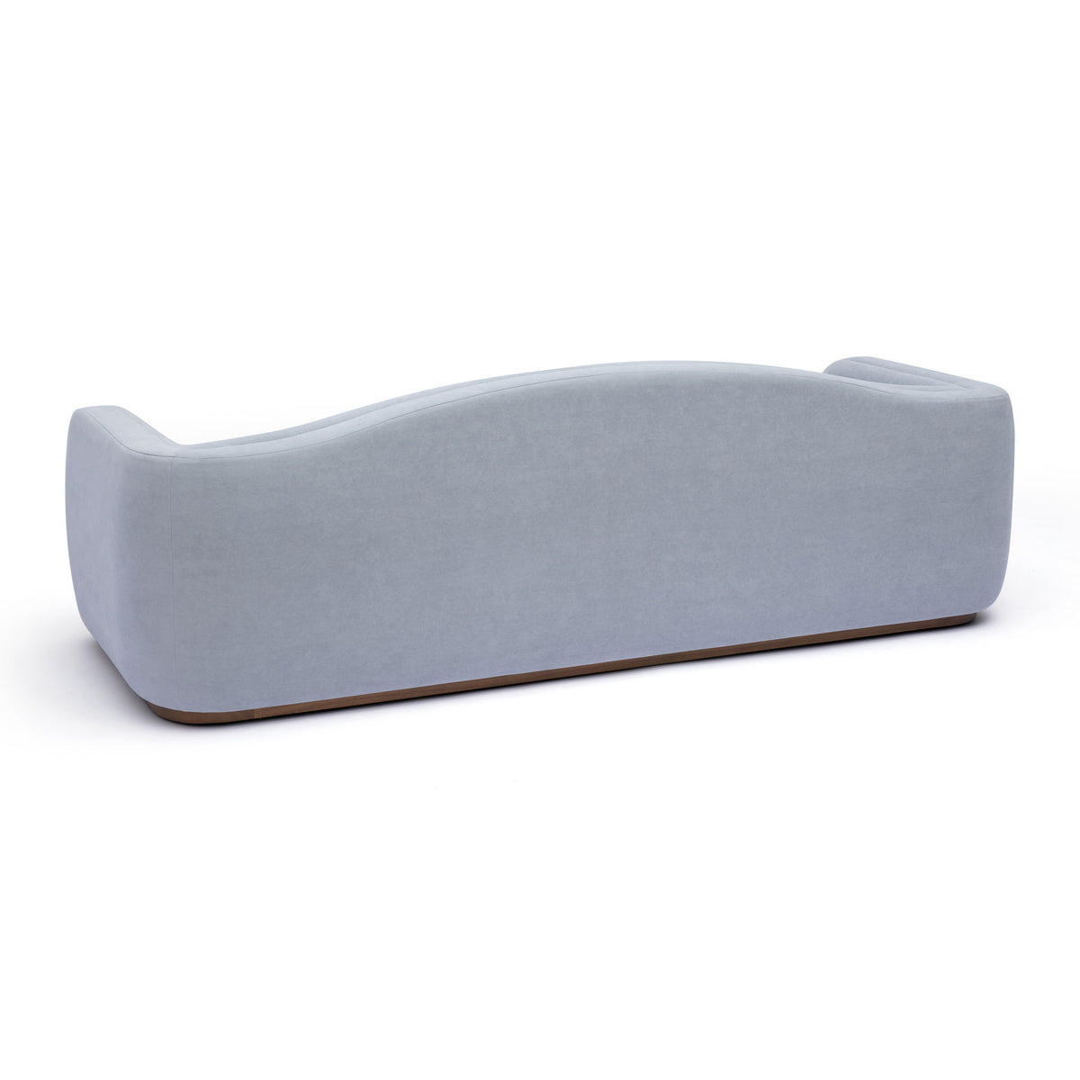 Light blue fabric sofa side view with rounded backrest and low base