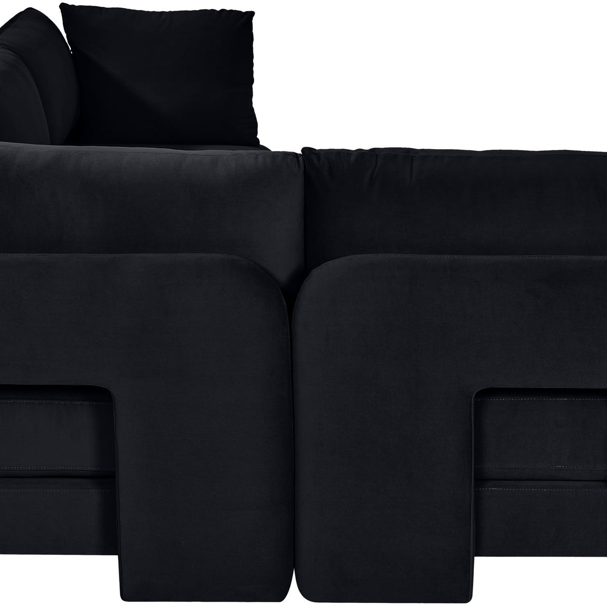 Black armless velvet sectional sofa with tufted look and back pillows, 4-piece set.