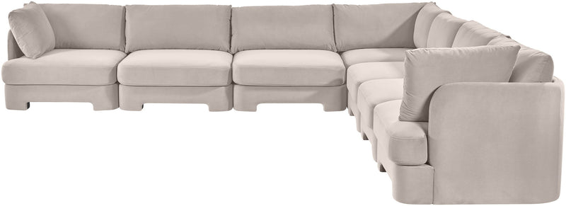 Light gray velvet corner sectional sofa with tufted seat cushions and rounded arms