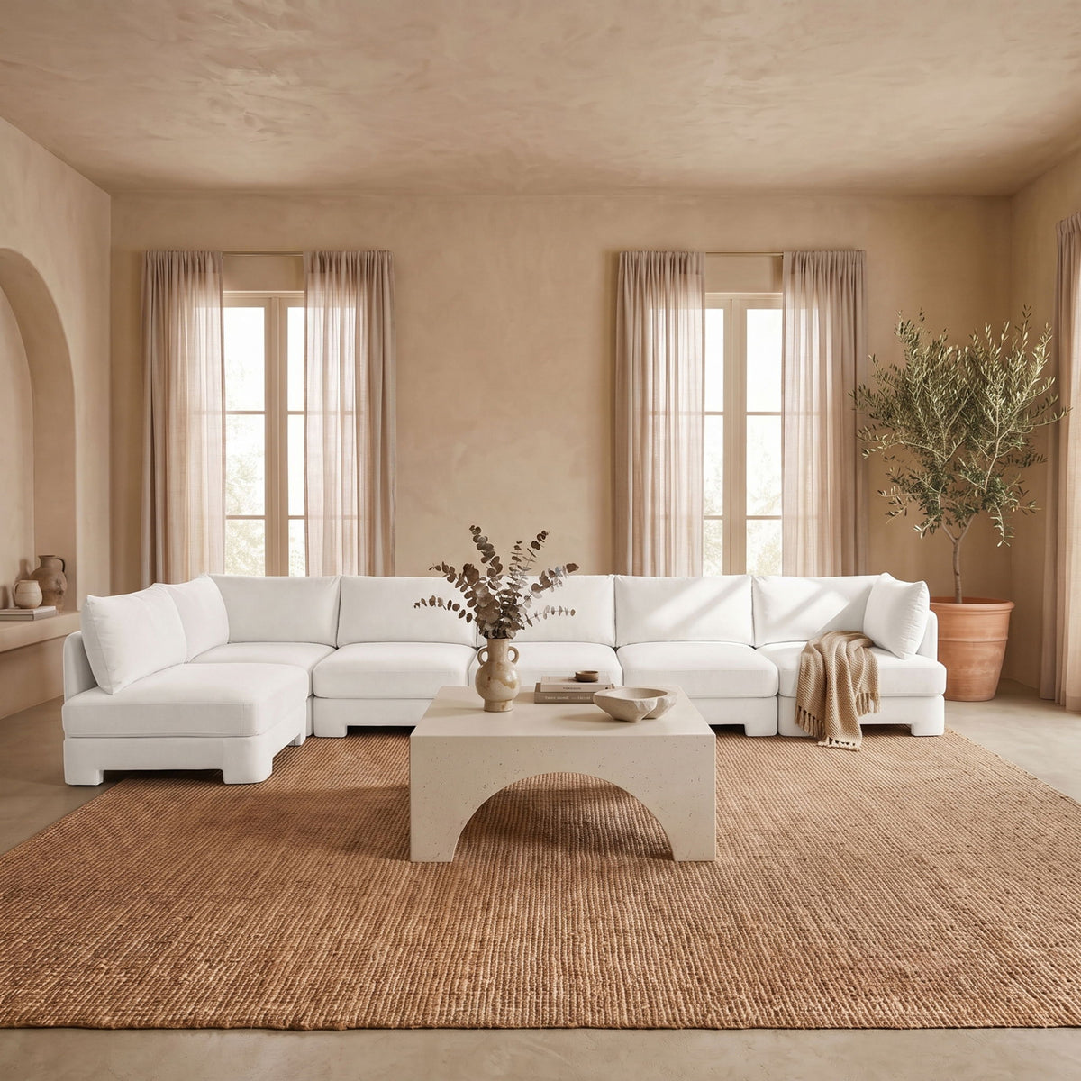 White L-shaped armless sectional sofa with velvet-style upholstery and plush seat cushions