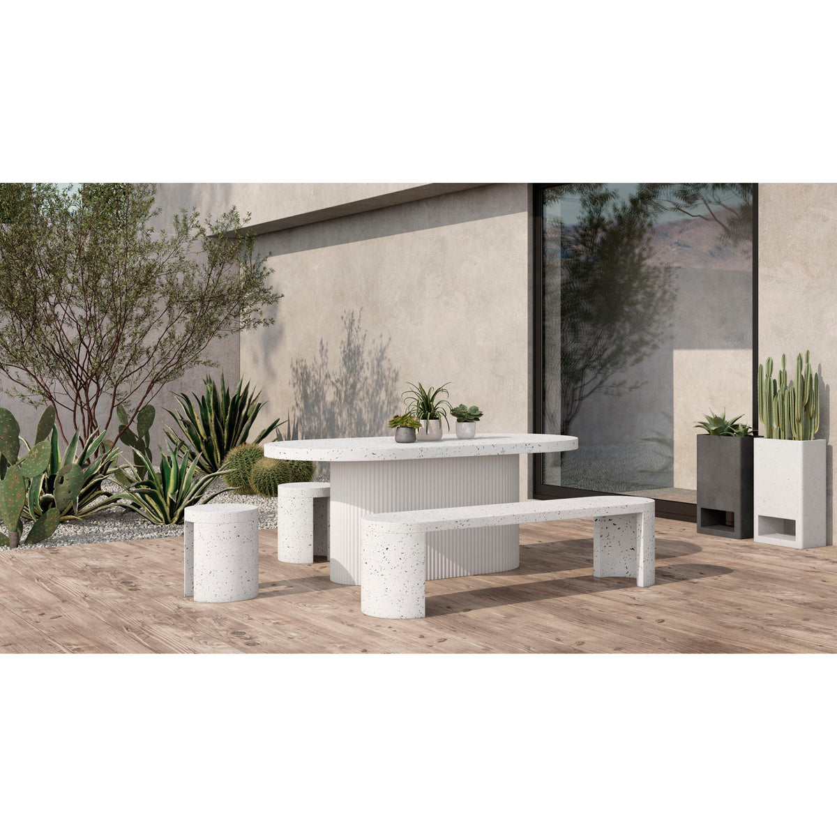Outdoor dining table with speckled round top and ribbed pedestal base