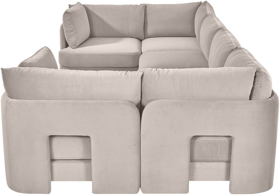 Light gray velvet U-shaped sectional sofa close-up with padded arms and back cushions