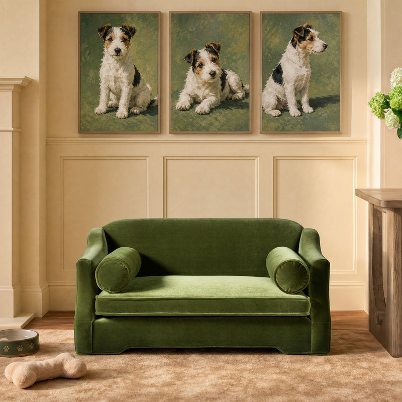 Green dog sofa bed with velvet-like upholstery, low profile, and two rounded arm bolsters