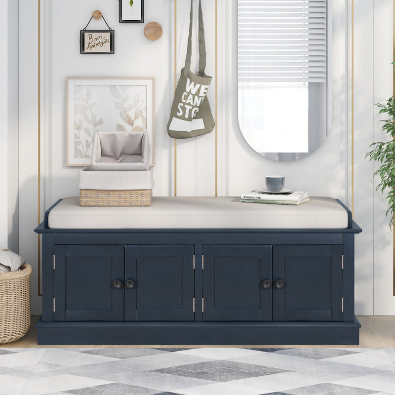 Blue shoe bench with a light cushion and four storage doors