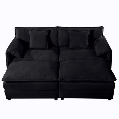 Black modular sectional sofa with deep seats, chaise ottoman and back pillows