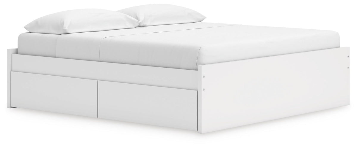 White platform bed with drawer fronts on the front and side
