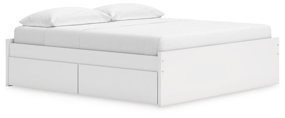 White platform bed with drawer fronts on the front and side