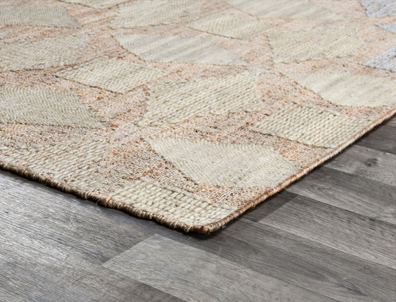 Flatweave rug corner close-up with beige weave and multicolor diamond-thread pattern