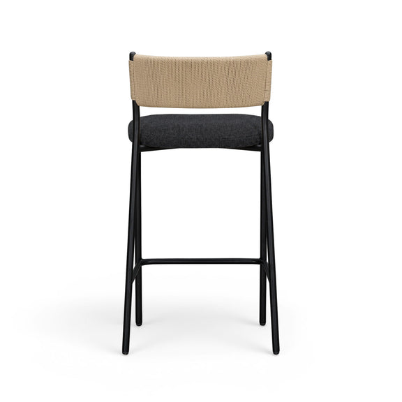 Celine boucle bar stool with beige upholstered back, dark seat, black metal legs.
