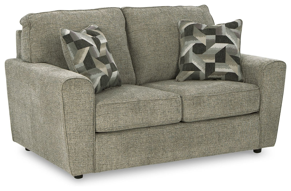 Light gray loveseat with two patterned throw pillows, upholstered arms and square cushions