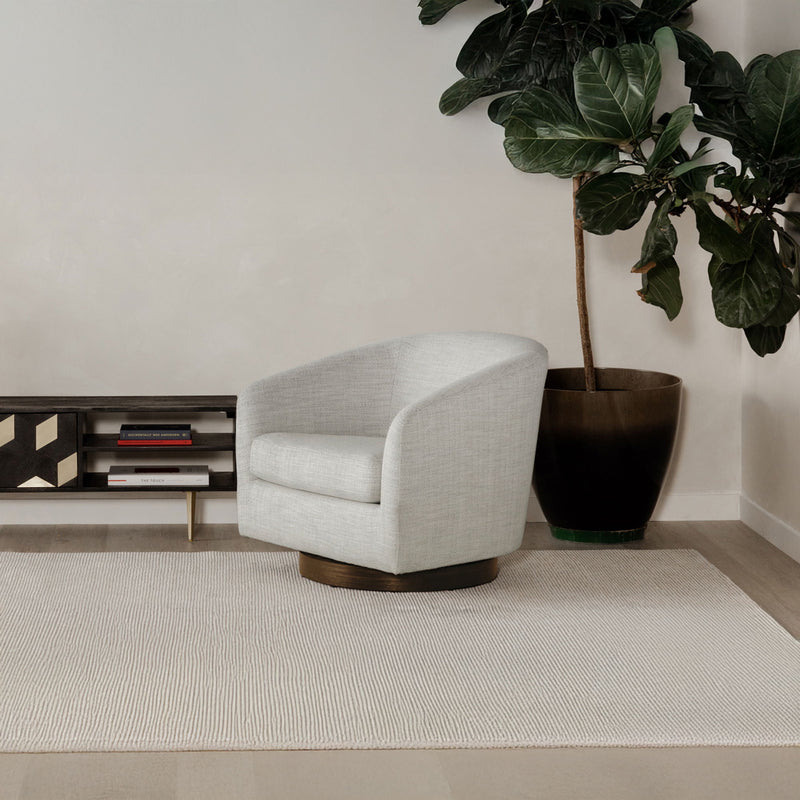 Light gray swivel chair with rounded armrests, cushioned seat, and wooden base