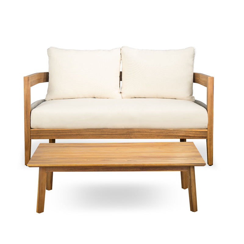 Outdoor loveseat with beige cushions, teak arms, and rectangular wooden coffee table