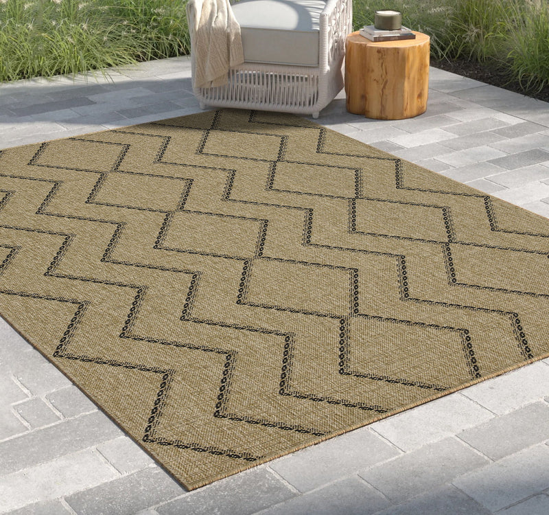 Light brown polypropylene area rug with dark zigzag and diamond stitched pattern