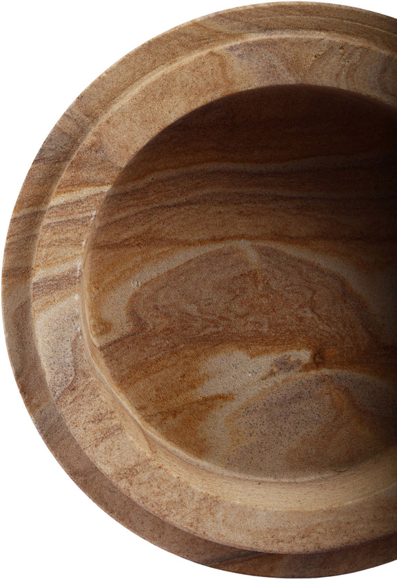 Interior view of light brown sandstone bowl with smooth cavity and stone veining.