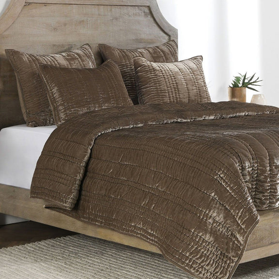 Desert taupe quilt set with textured stitching and four decorative pillows