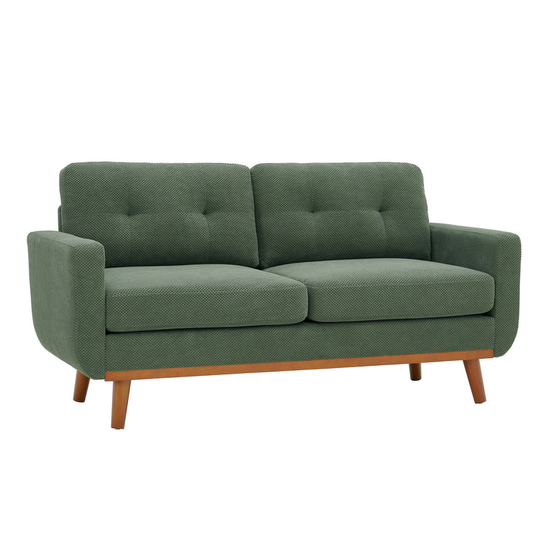Two-seat sofa in muted green fabric with tufted back cushions and wooden legs