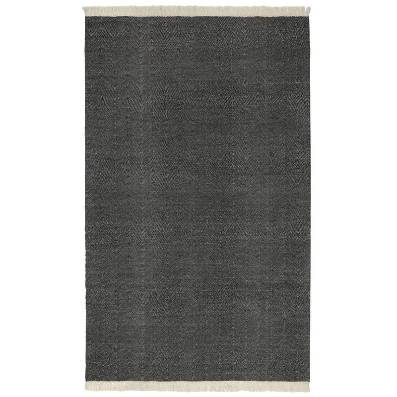 Charcoal indoor/outdoor rug with subtle texture and cream fringe