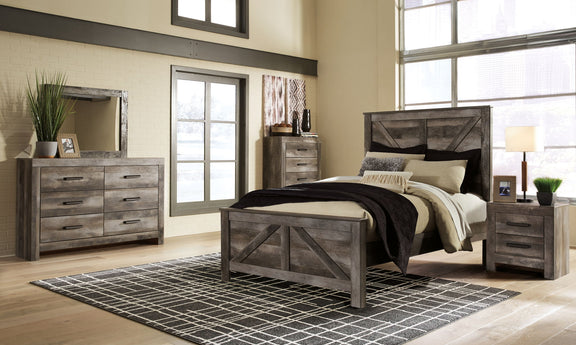 Gray crossbuck panel bed frame with slatted rails and two matching nightstands