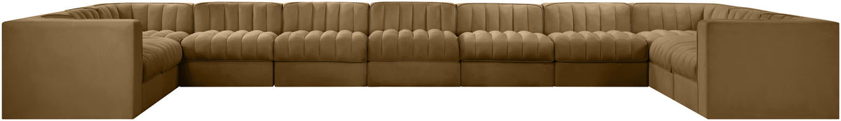 Tan modular sectional sofa with velvet-look upholstery and tufted cushions