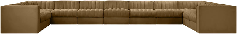 Tan modular sectional sofa with velvet-look upholstery and tufted cushions