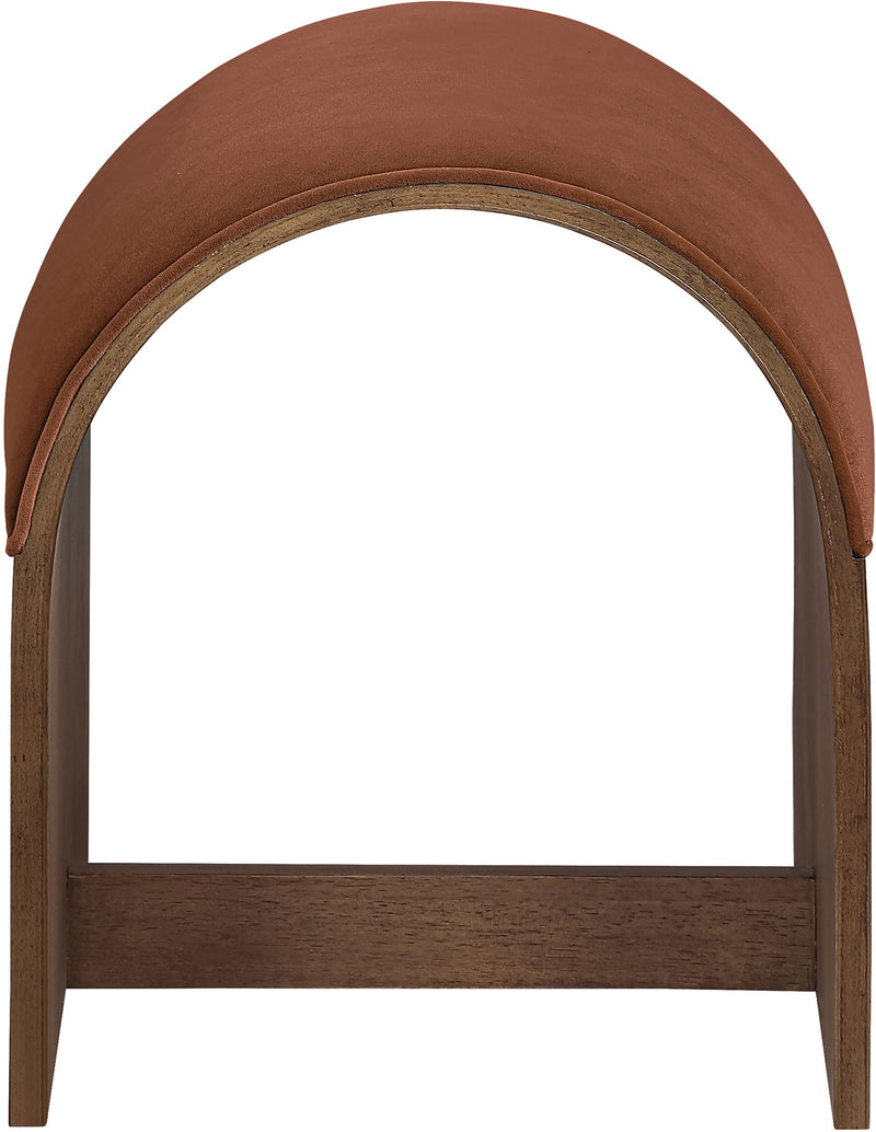 Dark brown velvet upholstered bench end with arched back and dark wood frame